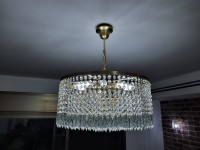 Photograph of a drum crystal chandelier in the interior of the restaurant