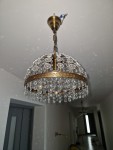 Chandelier for lighting the corridor of the apartment