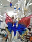 Detail of hanging a glass butterfly