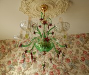 Chandelier with glass birds (hummingbirds) in a real interior