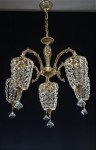 General view of an exceptional cast chandelier with metal arms