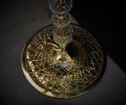 The lamp has great stability. In the lower part there is a steel disk with a brass and glass cover.