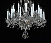 Detail of a large crystal chandelier in the French style of long candles