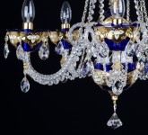 The 5 Arms Blue enameled crystal chandelier with glass flowers on the gold base