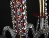 Center of a red chandelier with cut stones of leaded glass (Strass)