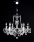General view of a silver chandelier hanging in a bedroom