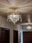 Hotel corridor ceiling with these chandeliers