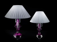 Two versions of a purple glass lamp with a white lamp-shade