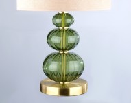 A lamp with three green balls as a symbol of balance in the interior.