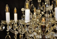 Detail of candles on the chandelier of Maria Theresa antique brass