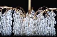 Detail of individual crystal glass berries - they can contain bubbles that beautifully reflect light into the space.