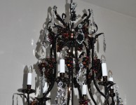 Top of brown stained chandelier with brown glass grapes