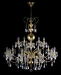 General view of a large brass chandelier made of pressed gold metal