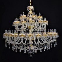 Representative 42-arm large white crystal chandelier with glass flowers on the gold background