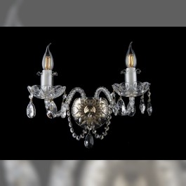 Wall light with twisted arms and crystal glass bowls in the shape of an optical lens