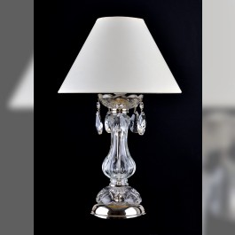 Glass lamp on the bedside table in the bedroom with lampshade - silver metal