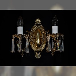 2-arm cast brass wall light with crystal hooves