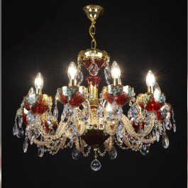 Lit Ruby red crystal chandlier to the living room