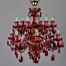 A dark red 12-arm crystal chandelier with gold metal