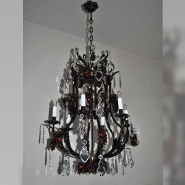 Dark brown brass chandelier with flat crystal trimmings and decorative cast brass ceiling rose.