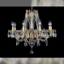 Detail of a crystal chandelier with metal arms made of (brushed) matte brass