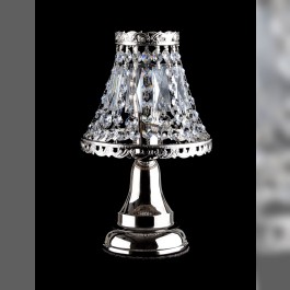 A small silver lamp made of strass stones for a bedside table