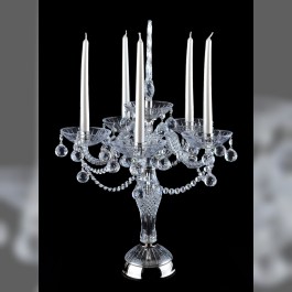 large crystal candlestick on a table made of silver metal and crystal glass