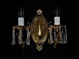 2-arm cast brass wall light with crystal hooves