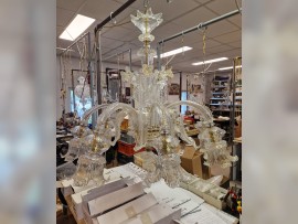 Installation of a Murano chandelier in a workshop