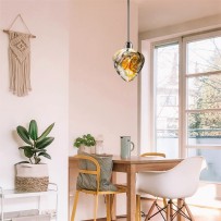 Chandelier with amber-smoky glass over the dining table