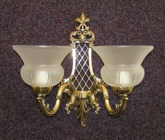 The two arms cast barss wall light with sand-balested vases