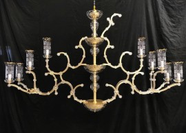 Installation of glass vases on a chandelier in the workshop