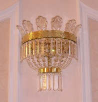 The crystal wall light with glass palm leaves