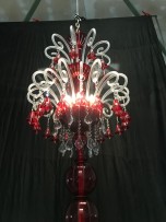 The top of the chandelier with 9 bulbs