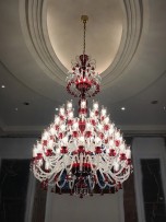 Ruby chandelier in fully lit state