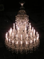 A large Terezin chandelier is lit.