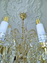 Detail of a chandelier with 24 light bulbs