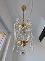 A small Maria Theresa chandelier in the bathroom