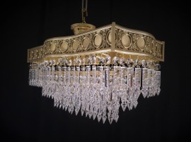 Detail of the rounded wall of the rectangular frame of the chandelier