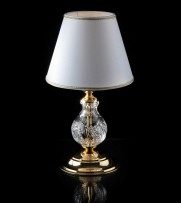 A classic clear crystal table lamp with a lampshade