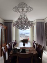 Colorful Theresian chandelier of 33 light bulbs in the interior of the apartment