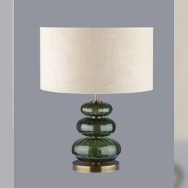 Table lamp made of dark green glass in the color of olivine stone