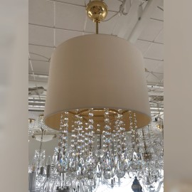 Crystal chandelier with a large textile lampshade