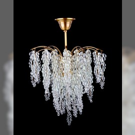 General view of chandelier with hand-woven glass grapes