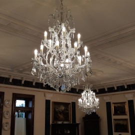 Theresian crystal chandeliers and wall lights making up the set