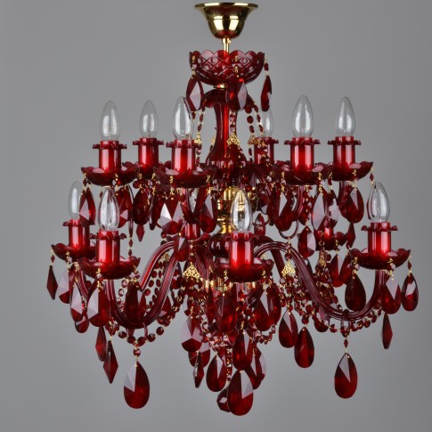 A dark red 12-arm crystal chandelier with gold metal