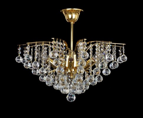 Golden crystal chandelier in the shape of a royal crown