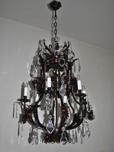 Dark brown brass chandelier with flat crystal trimmings and decorative cast brass ceiling rose.