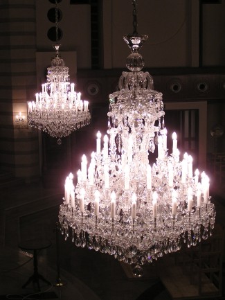 Large Theresian chandeliers - hanging two chandeliers on the ceiling in the church