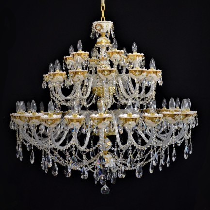 Luxurious large crystal chandelier decorated with flowers